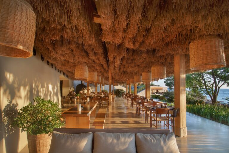 Anhinga restaurant dining area under a thatched roof, Six Senses Kaplankaya