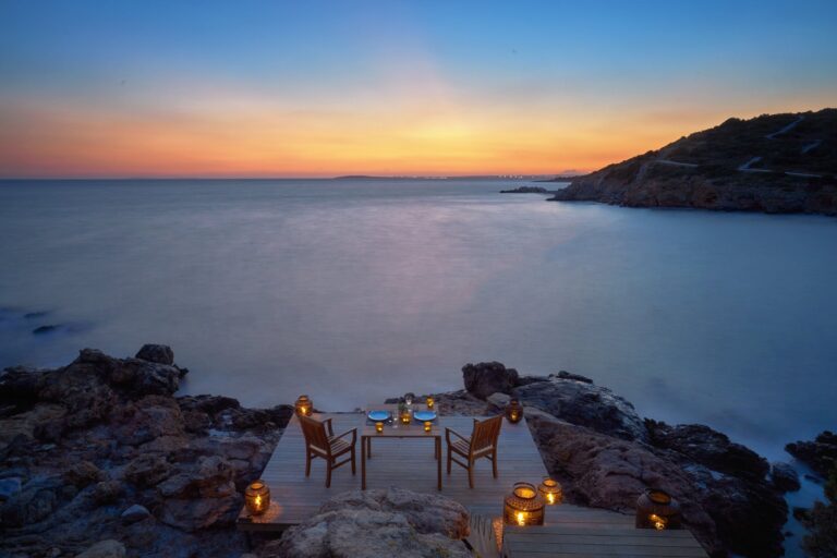 Lantern-lit deck by the rocky shore at sunset, Six Senses Kaplankaya