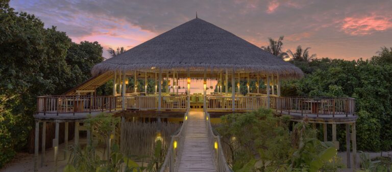 Leaf restaurant above the organic garden at dusk, Six Senses Laamu