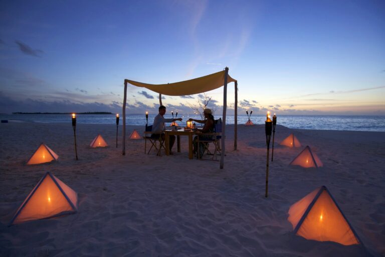Beach dinner for two beneath a canopy by torchlight, Six Senses Laamu
