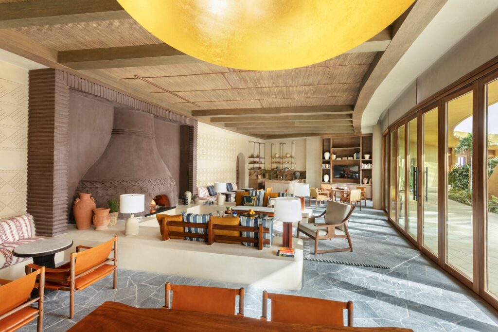 The Community Lounge with its glowing ceiling disc, Six Senses Southern Dunes