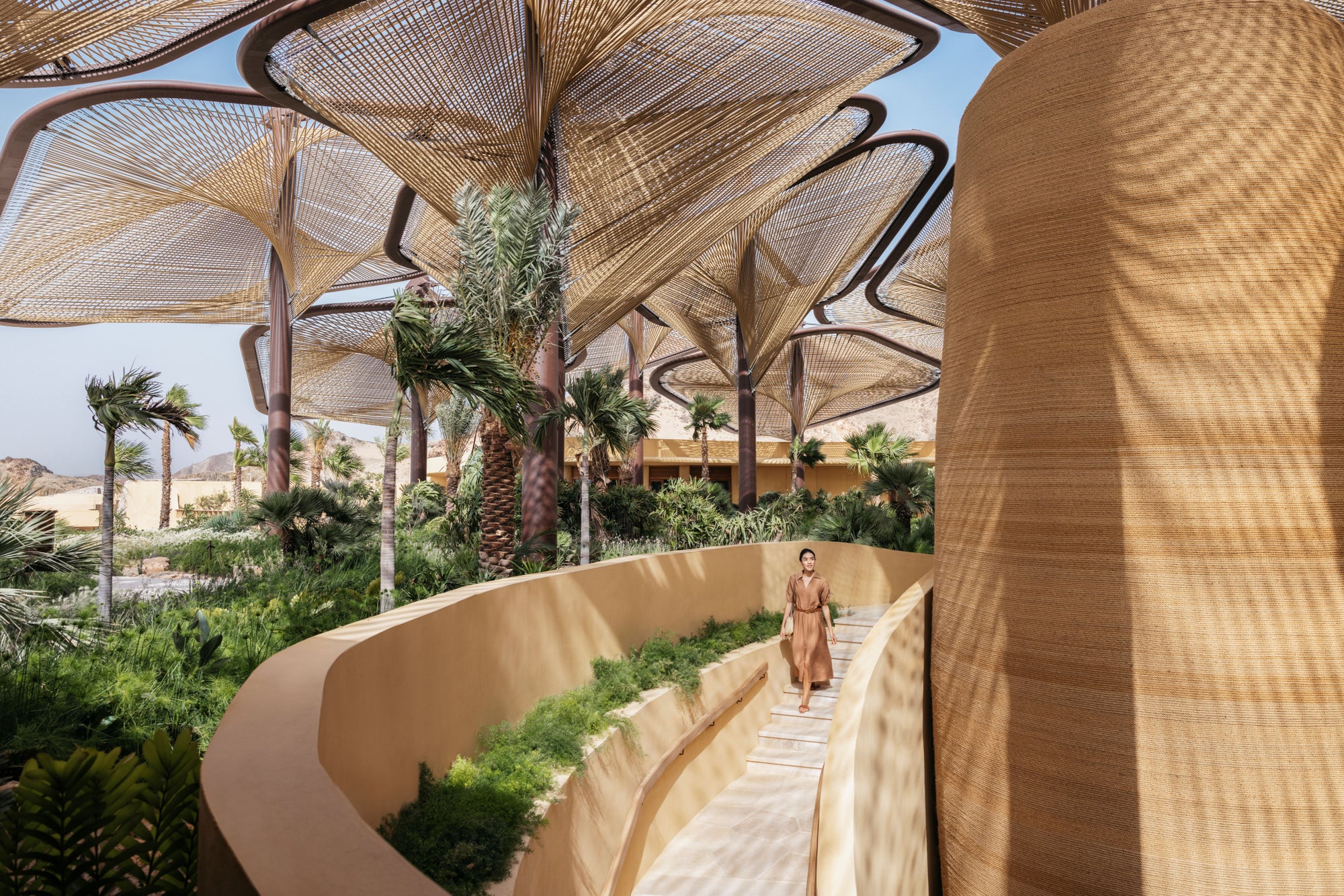 The path through the spa gardens beneath woven canopies, Six Senses Southern Dunes
