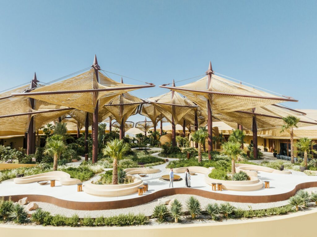 The Oasis canopies and courtyard seen from the air, Six Senses Southern Dunes