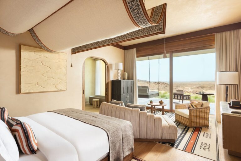 A Wadi King Room with a terrace door open to the desert, Six Senses Southern Dunes