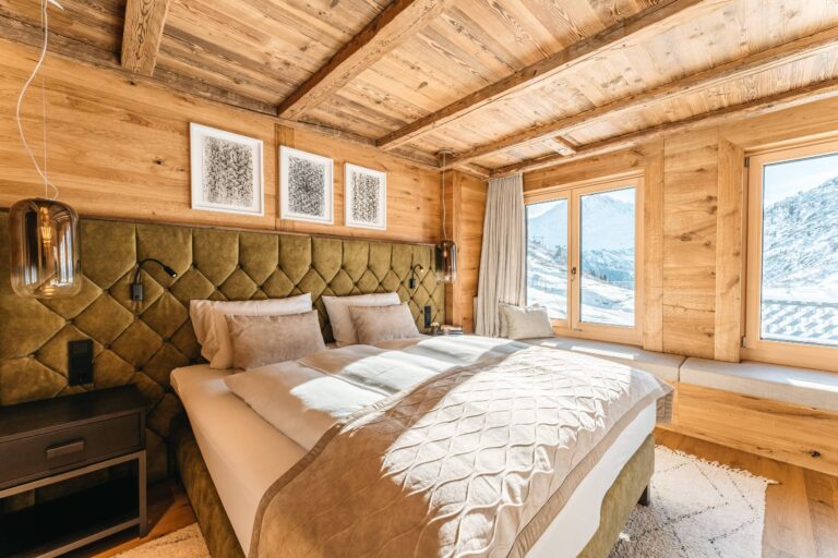 Room with green upholstered headboard, Ski Hotel Maiensee