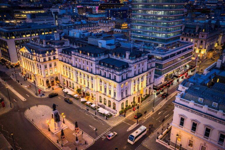 The hotel and Waterloo Place from above at night, with Pall Mall running past the corner, Sofitel London St James