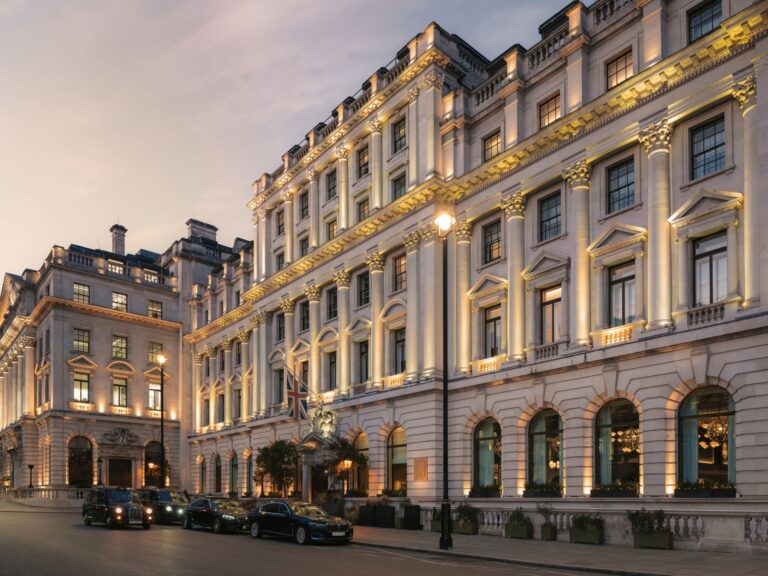 The hotel corner on Pall Mall at dusk, with cars waiting at the kerb, Sofitel London St James