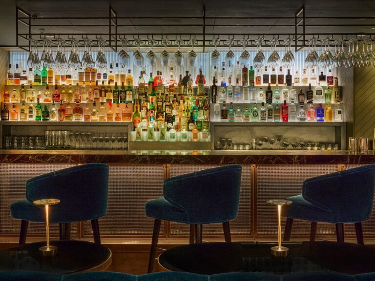 The back bar at St James Bar with velvet stools, Sofitel London St James