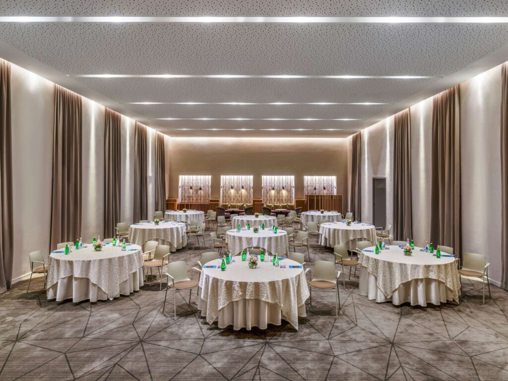 Event room laid with round tables, Sofitel Marrakech Lounge and Spa