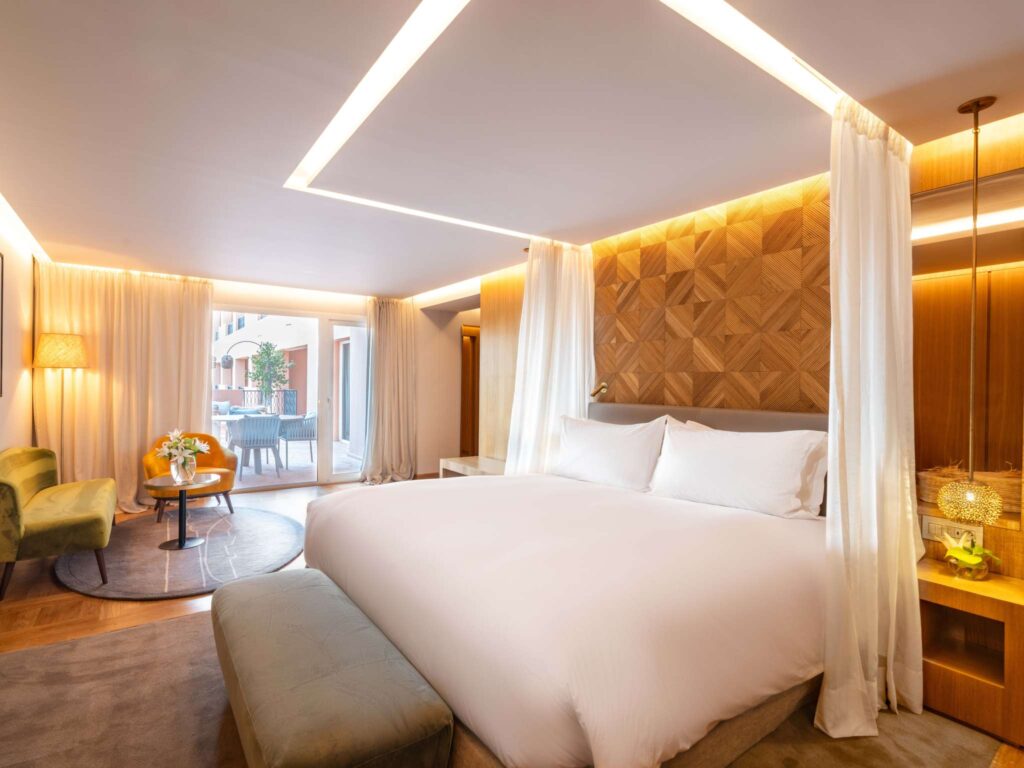 Suite bedroom with canopy drapes, Sofitel Marrakech Lounge and Spa
