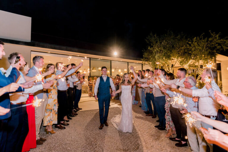 Guests forming a sparkler tunnel for the couple at night, Sonho a Dois Algarve Wedding Planners