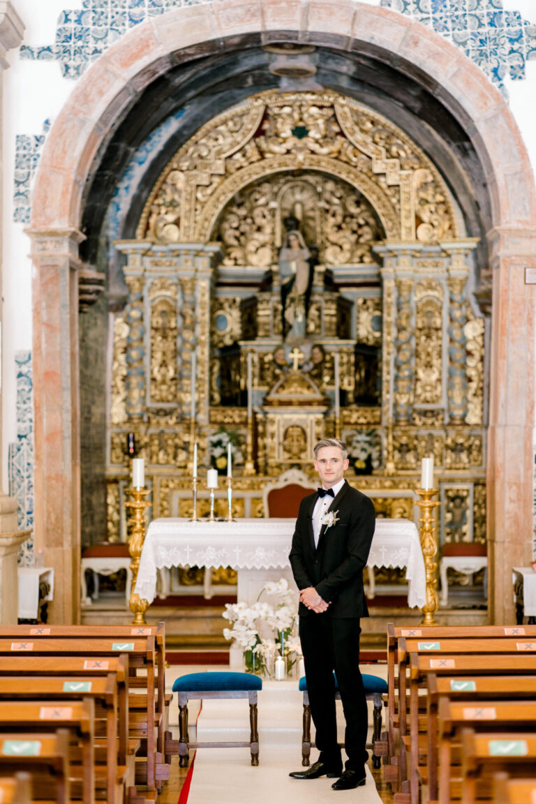Groom waiting before a gilded baroque church altar, Sonho a Dois Algarve Wedding Planners