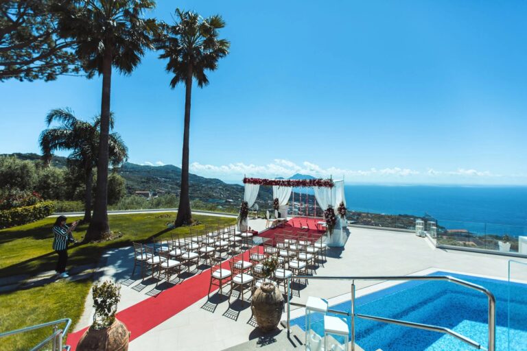 Ceremony set-up with a red aisle beside the pool at Villa Eliana, Sorrento, Sophisticated Weddings