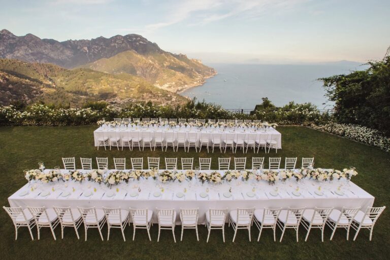 Long tables on the lawn at Belmond Hotel Caruso, Ravello, above the coast, Sophisticated Weddings