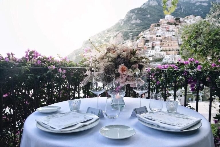 Table for an elopement dinner with Positano behind, Sophisticated Weddings