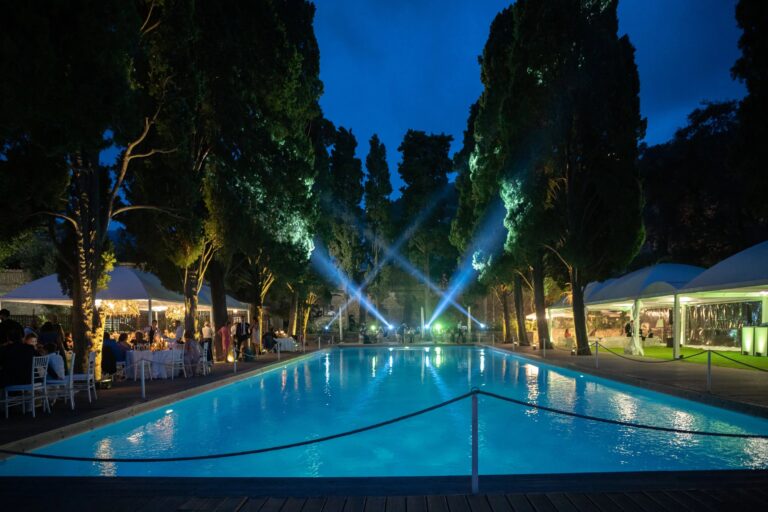 Evening reception lit around the pool at Villa Zagara, Sorrento, Sophisticated Weddings