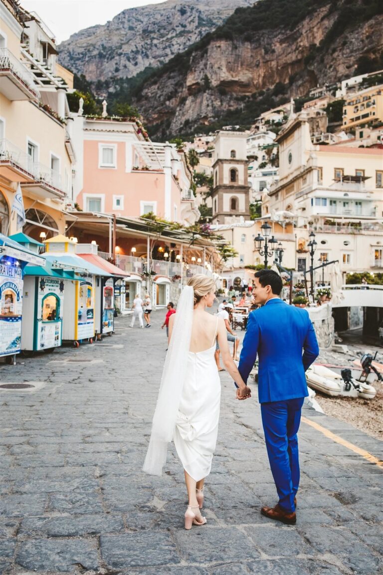 Couple walking through Positano after the ceremony, Sophisticated Weddings