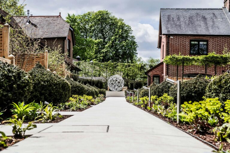 A paved garden path between planted borders, Sopwell House
