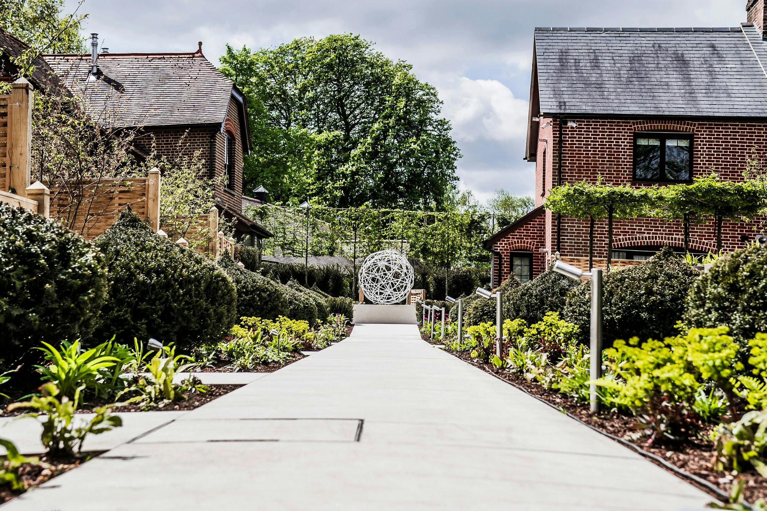 A paved garden path between planted borders, Sopwell House