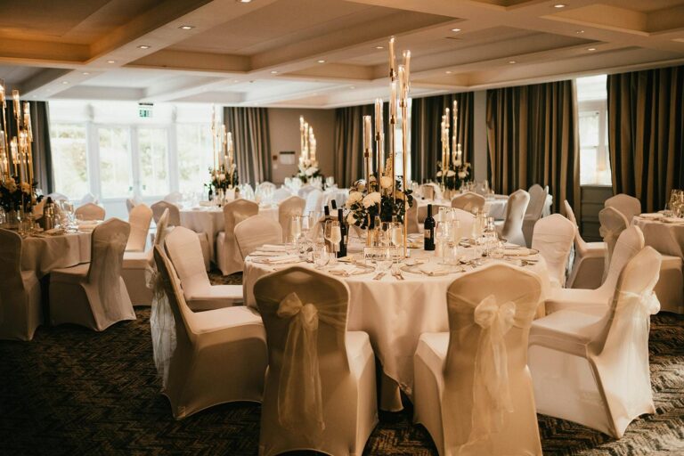 Round tables with chair covers in a function room, Sopwell House