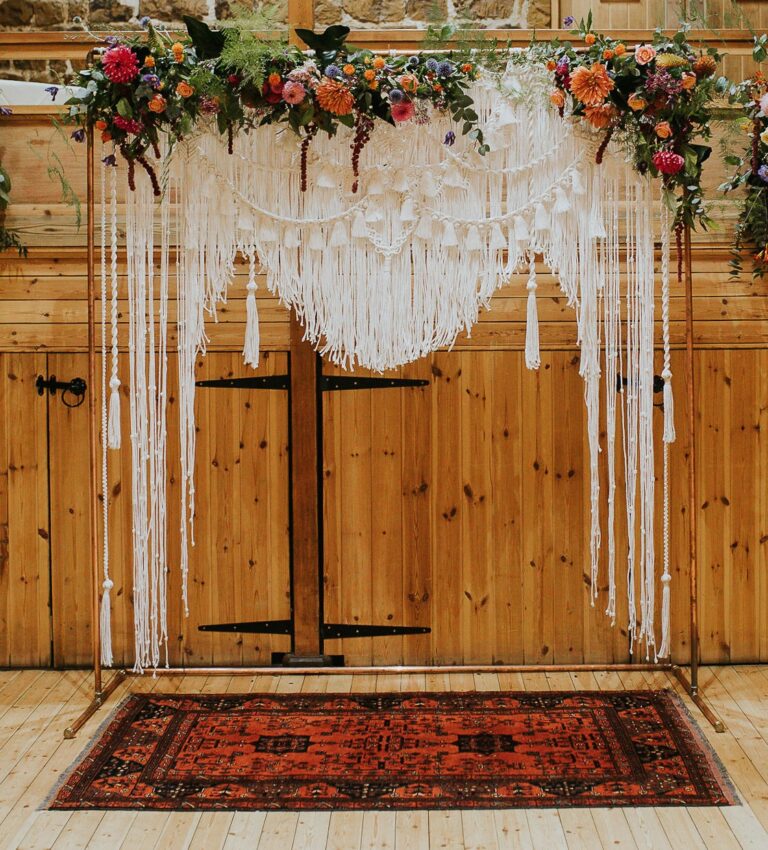 A macrame and dried flower installation, the ceremony door, Sorcha Herbert Flowers