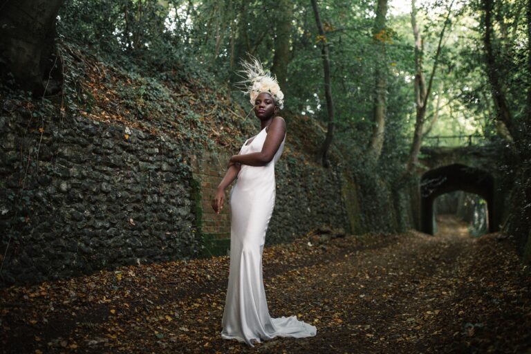 Bridal portrait, an ivy-covered stone archway, Sorcha Herbert Flowers