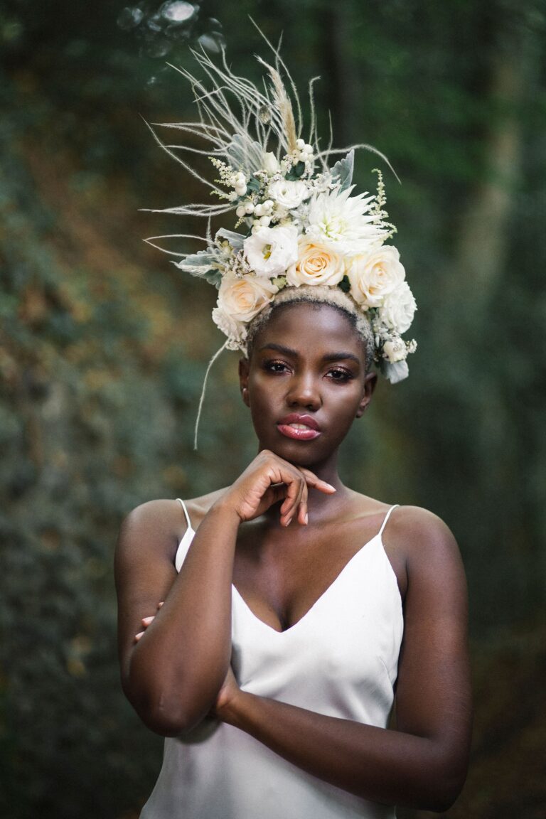 Bridal portrait, a headpiece of feather and dried flowers, in the woods, Sorcha Herbert Flowers