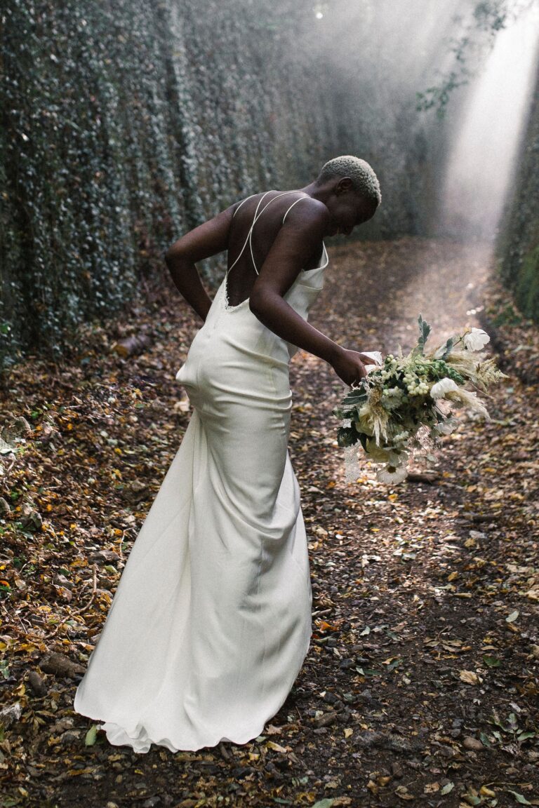 Adjusting the bouquet, a beam of light through the trees, Sorcha Herbert Flowers