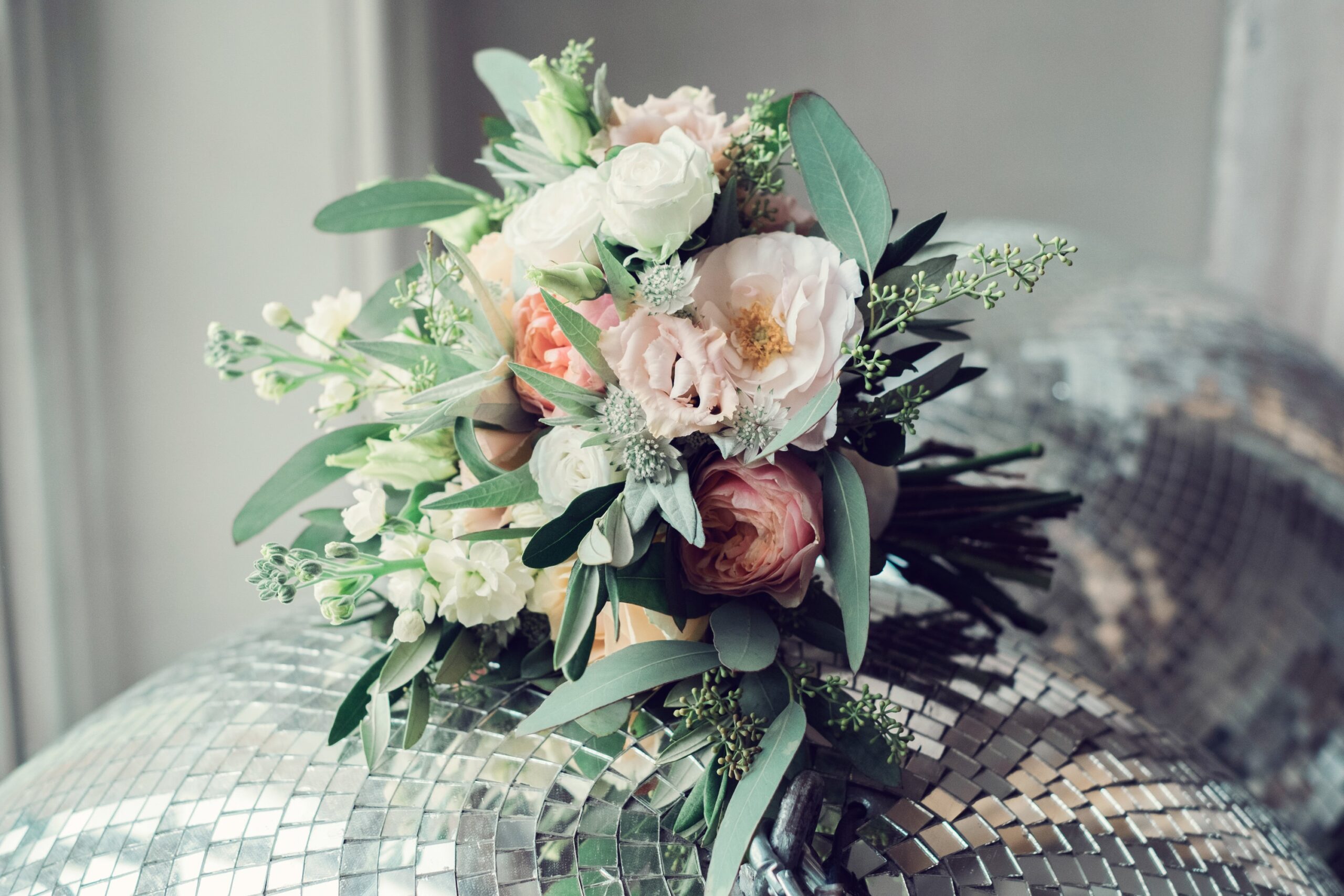 A bouquet of pampas grass and protea, on a wooden ledge, Sorcha Herbert Flowers