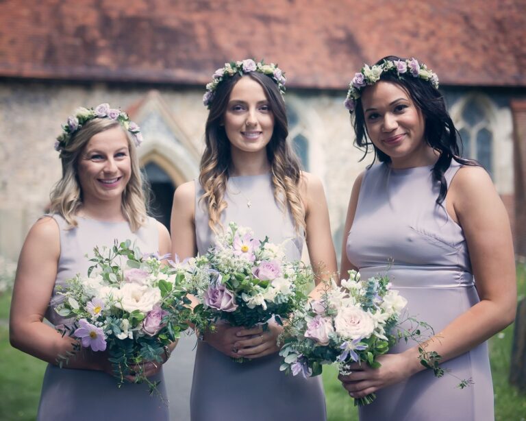 Bridesmaids in dusty lavender, flower crowns, a stone church, Sorcha Herbert Flowers