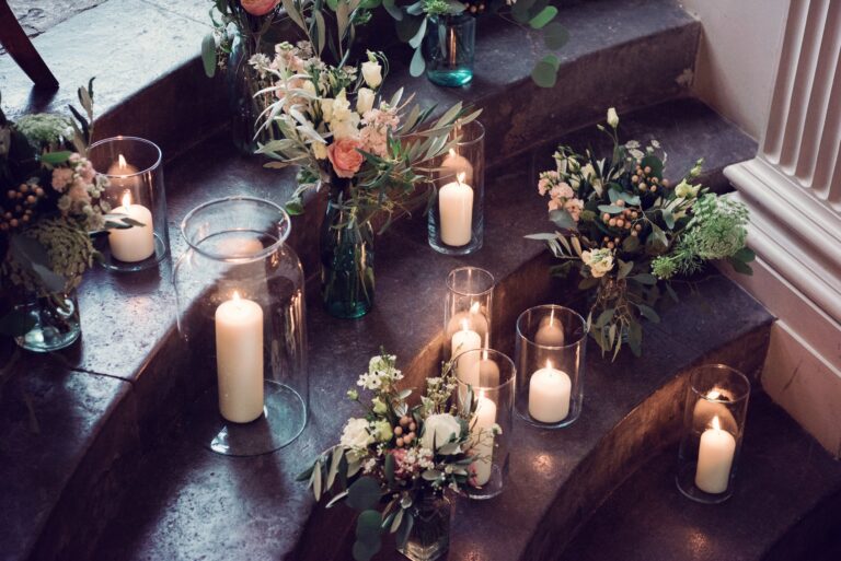 Candlelight on stone steps, garlanded in flowers, Sorcha Herbert Flowers
