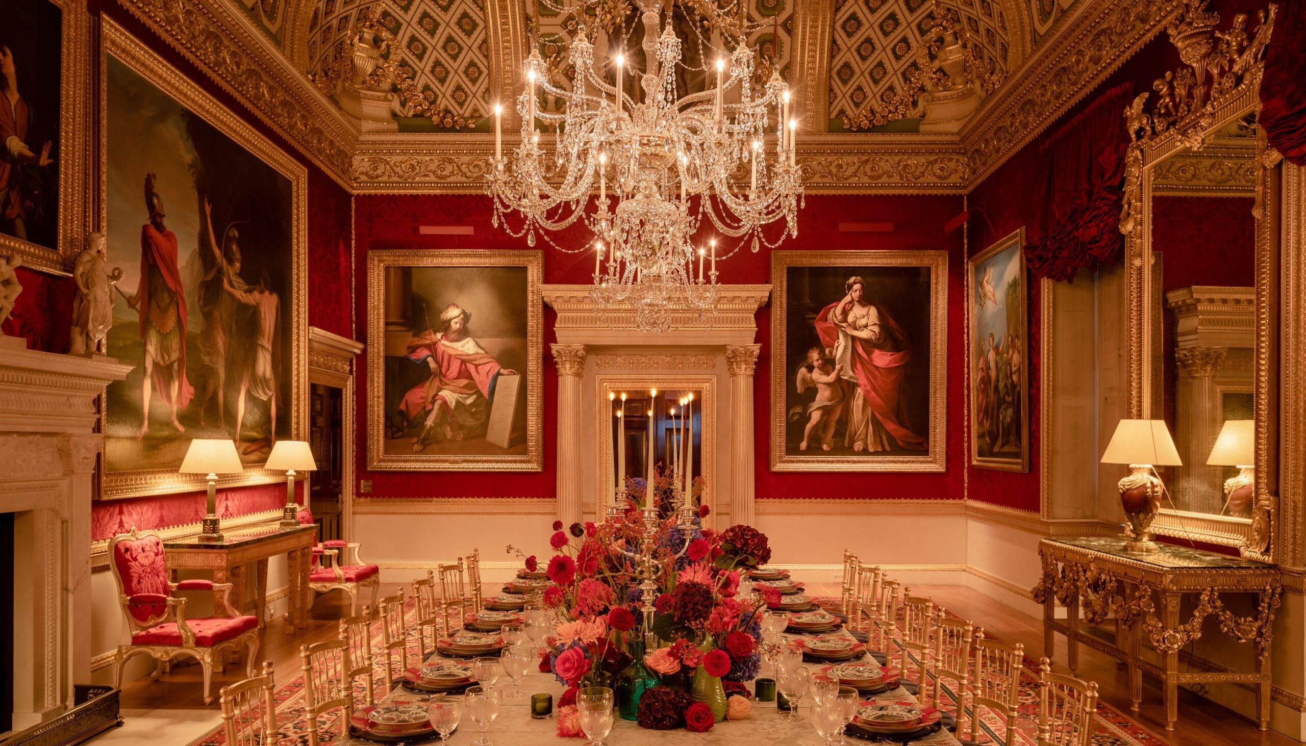 The Great Room dressed for a wedding, candlelit tables set beneath its gilded coffered ceiling, Spencer House