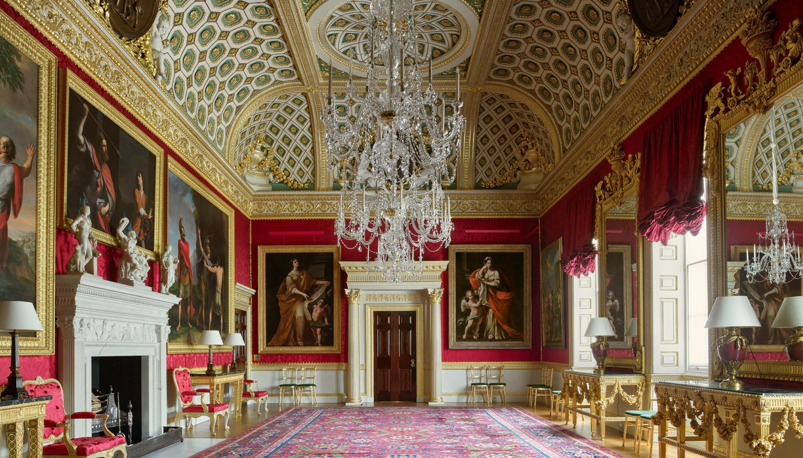 The Great Room, its walls hung in crimson silk beneath a coffered ceiling modelled on the Basilica of Maxentius in Rome, Spencer House