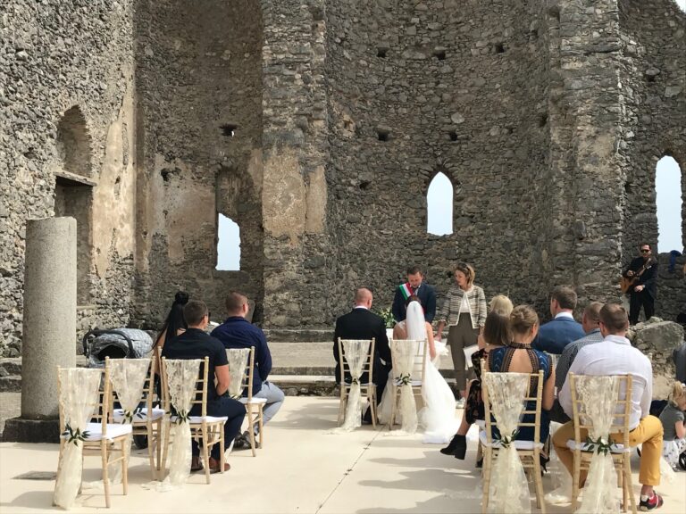 The same ruin at ground level, gold chairs set out on the flagstones, Sposa Mediterranea By A&C