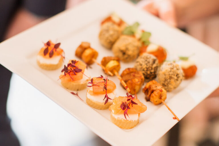 A plate of canapés, including smoked salmon on crostini, Springkell