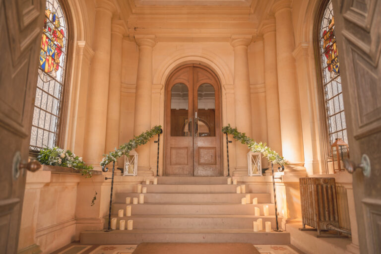 The porch steps dressed with candles and garlands between two stained glass windows, Springkell