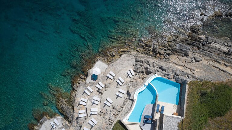 Aerial view of the hotel pool above the rocky shore, St Nicolas Bay Resort Hotel and Villas