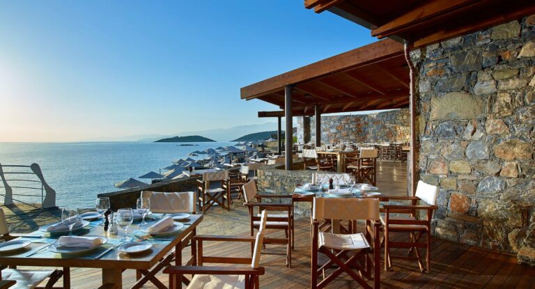 The Blue Bay beachfront restaurant terrace, St Nicolas Bay Resort Hotel and Villas