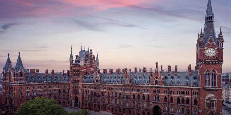 The Gothic Revival frontage of the hotel at dusk, St Pancras Renaissance Hotel London
