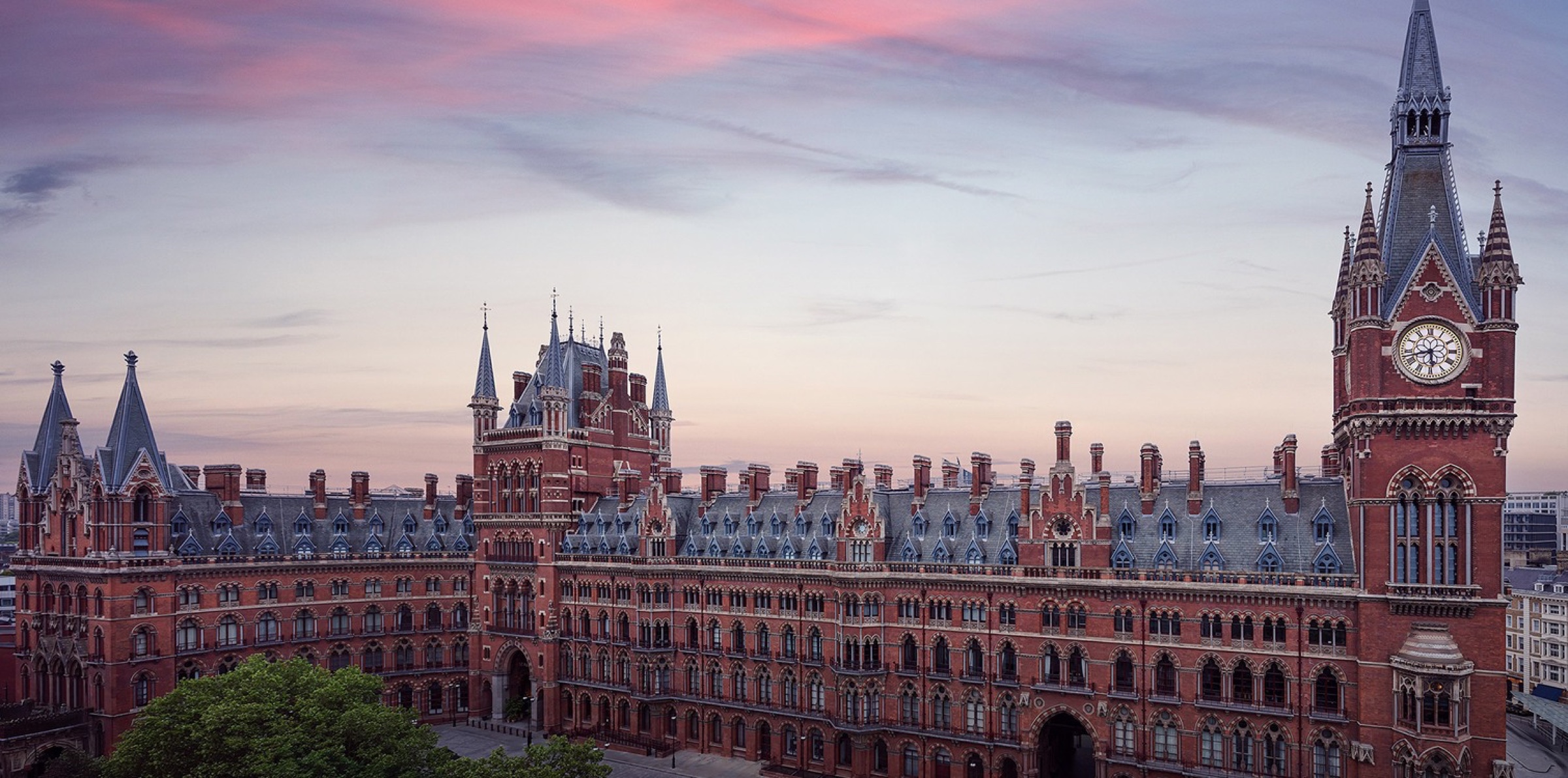 The Gothic Revival frontage of the hotel at dusk, St Pancras Renaissance Hotel London
