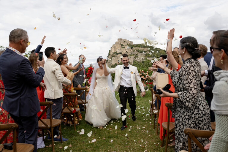Petal toss as Emily and Eliot leave their ceremony in the garden of the Torre di Michelangelo, Ischia, Stefania Silvestro