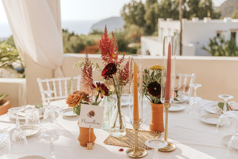 Table setting with dried flowers and tall candles at Marie and Claudio's countryside farmhouse reception, Ischia, Stefania Silvestro