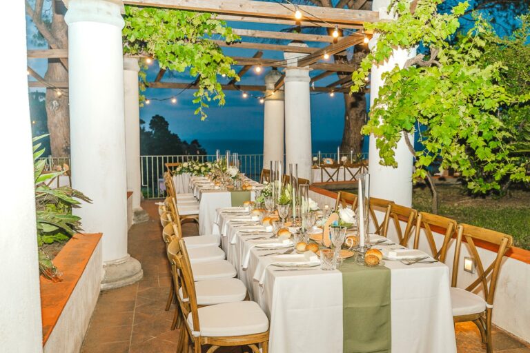 Long table under a vine pergola for Maria and Antonio's reception at a historical museum, Ischia, Stefania Silvestro