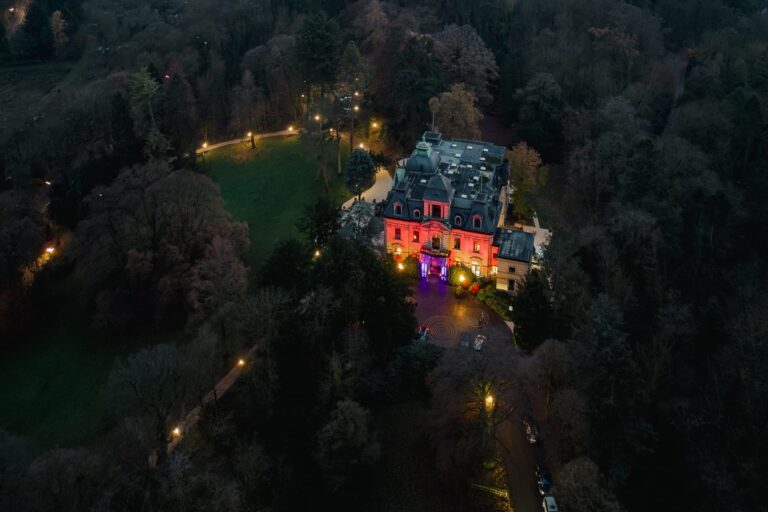 Villa and park at dusk from the air, Stella Rheni