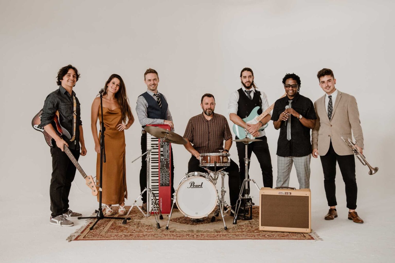 A seven-piece line-up with guitars, keys, drums and trumpet around a vintage amp