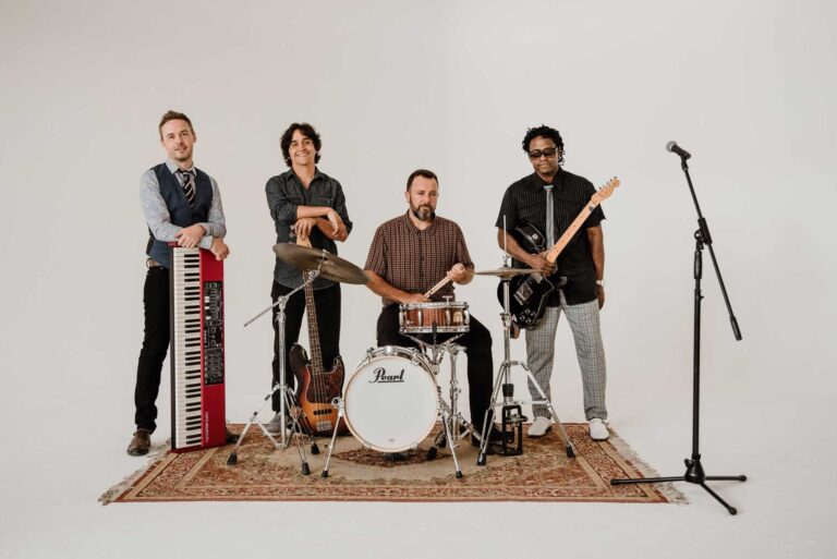 A rhythm section of keys, drums, bass and guitar with a vocal microphone, Stereo Star Band