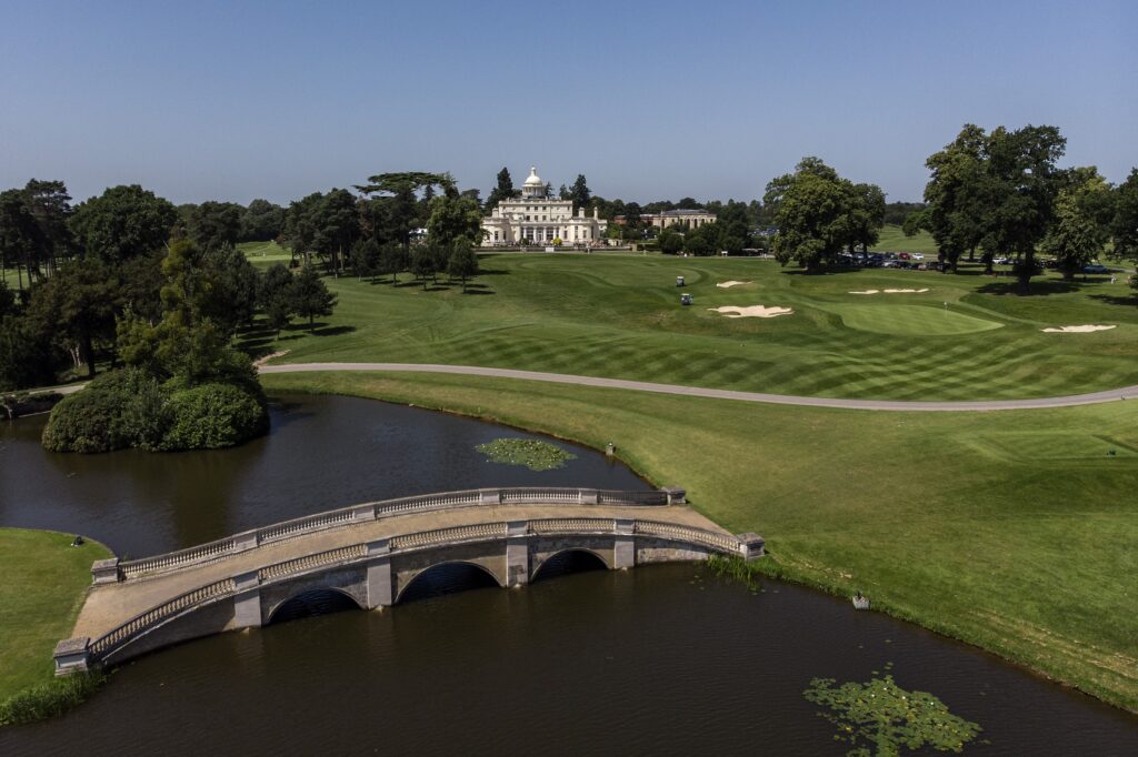 The mansion beyond the lake and stone bridge, Stoke Park