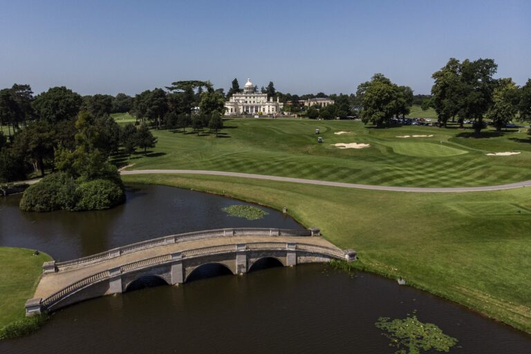 The mansion beyond the lake and stone bridge, Stoke Park