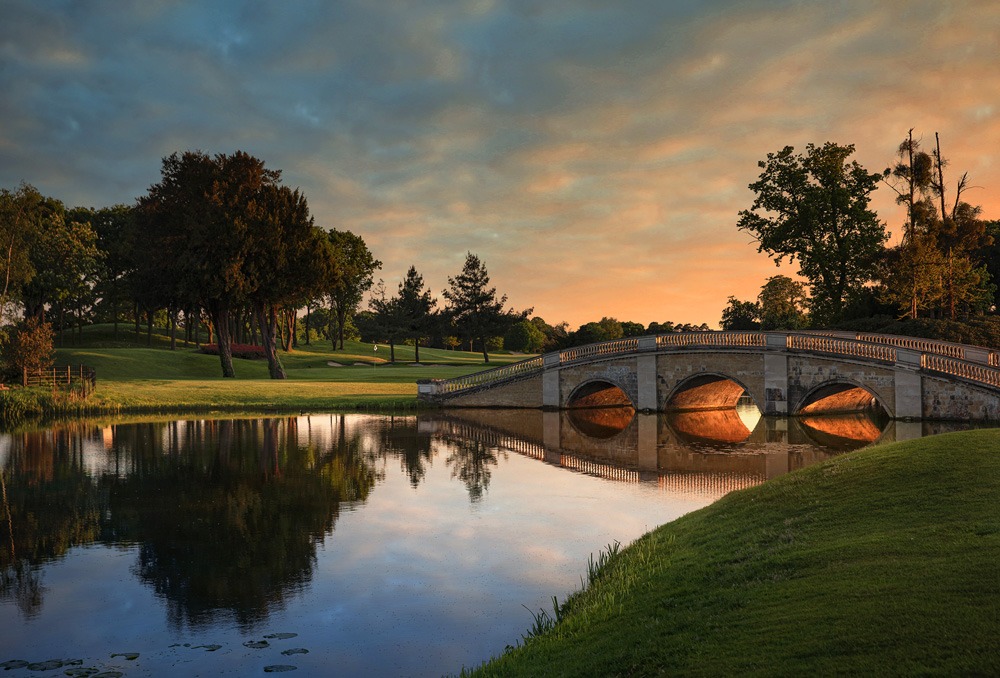 Stone bridge over the lake at sunset, Stoke Park