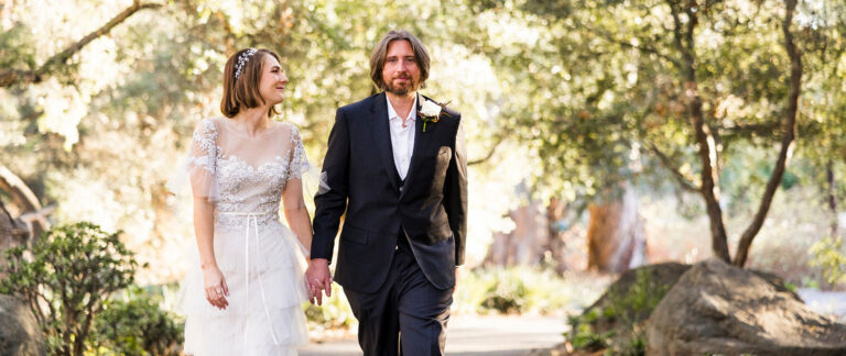 A bride and groom walk hand in hand through the gardens at their Santa Barbara wedding, California (film still), Story Of Your Day